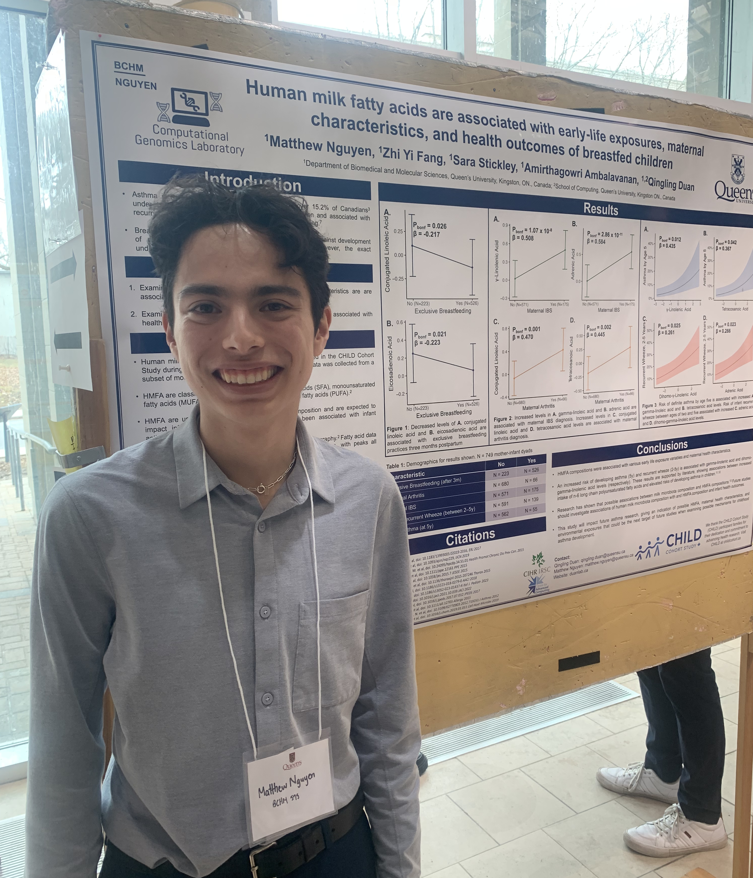 Matthew in front of his poster