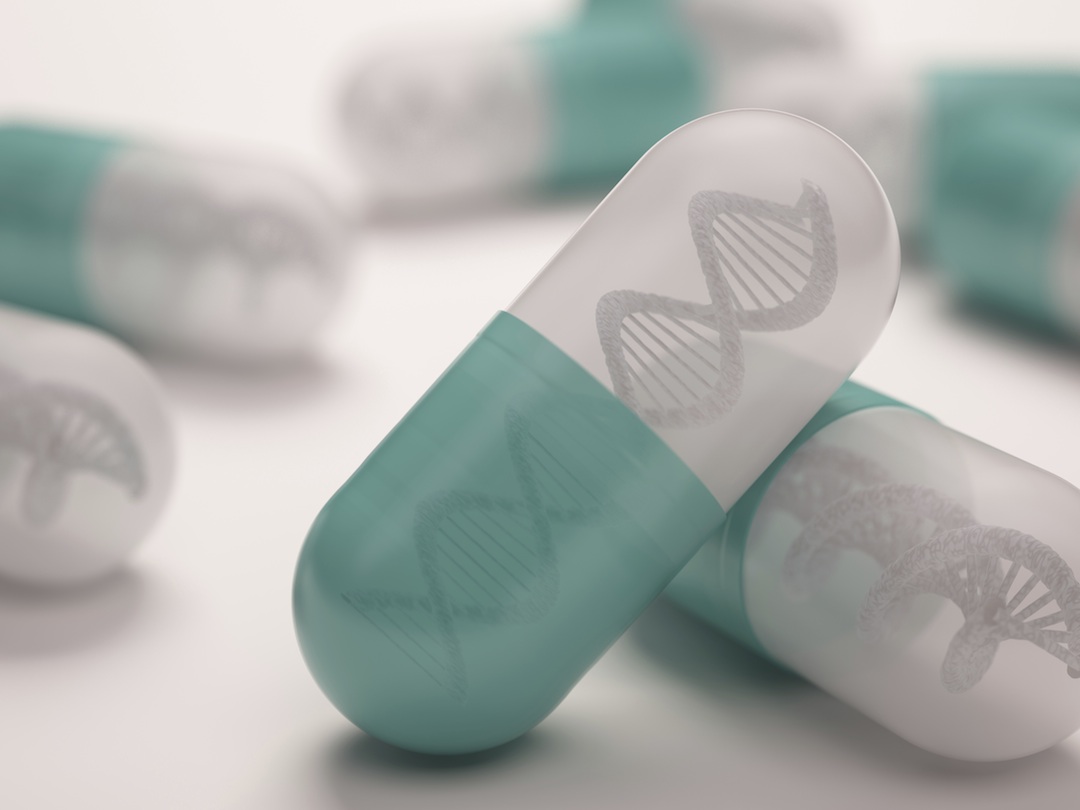 A white and cyan pill with the DNA double helix inside